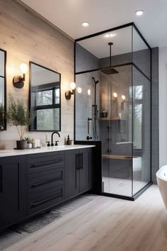 a bathroom with a tub, sink and shower stall in the middle of it's wood flooring