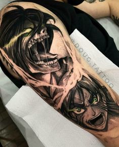 a man with a tattoo on his arm that has an evil face and two green eyes