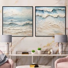 there are two paintings on the wall in this living room