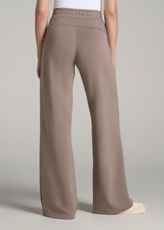 Versatile Wide Leg Tall Women's Pants Stay Comfy While Going Casual Our Pull-On Tie Waist Wide Leg Pants for Tall Women offer a blend of comfort and fashion. Whether strolling the neighborhood or staying fit, these tall pants for women are perfect for both athletic activities and casual outings, making them a versatile addition to any wardrobe.• Wide leg and regular fit for a modern look• Drawstring and elastic waist for a comfortable fit• Full length with side seam pockets SIZE & FIT: Tall Inse Pants For Tall Women, Scrubs Dress, Staying Fit, Tall Pants, Fall Denim, Flannel Women, Comfy Pants, Chino Jeans, Sleeveless Bodysuit