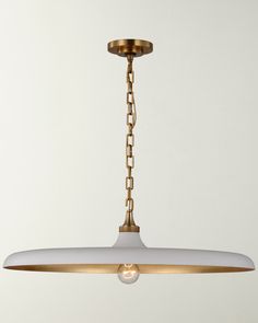 a white and gold pendant light hanging from a ceiling fixture with chain links on it