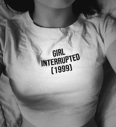 a woman wearing a shirt that says girl interrupted