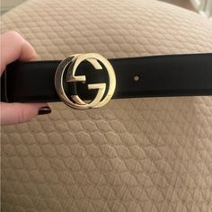 Authentic Gucci Calfskin Belt. Easy To Wear With Jeans And Dresses. Used Belt Has Marks Shown In The Pictures. Still Very Wearable. Size 41.25 Total Length With Buckle. Without Buckle 40 Inches. Gucci Black Belt Buckles With Removable Belt, Gucci Formal Belt With Metal Logo, Luxury Gucci Belt With Gold-tone Hardware, Gucci Luxury Gold-tone Belt, Luxury Black Belt Buckles With Gold-tone Logo, Gucci Accessories, Gucci Black, And Dresses, Leather Belt