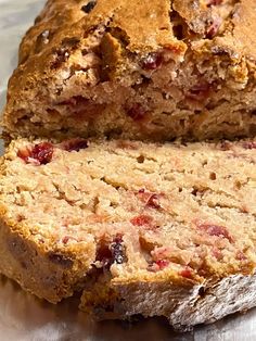 a loaf of fruit bread sitting on top of a table