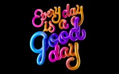 the words today is a good day written in neon colored letters on a black background