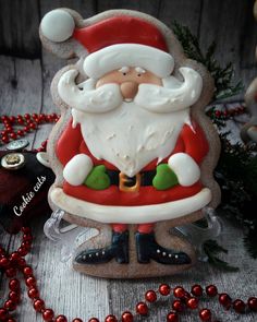 a santa clause figurine sitting on top of a table