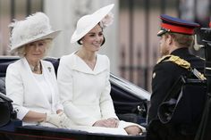 two women sitting in the back of a carriage