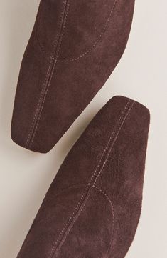 A stretchy shaft in a knee-high silhouette and square toe add modern elements to this supple suede boot lifted by a modest block heel. Side zip closure Leather upper, lining and sole Made in Brazil Sustainable Shoes, Oversized Turtleneck, Modern Elements, Knee Boot, Leather Blazer, Suede Boots, Low Heels, Knee High Boots, Black Suede