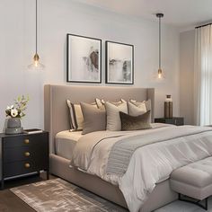 a bedroom with a large bed and two pictures on the wall