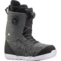 a pair of snowboard boots with white soles and grey knitted upper part