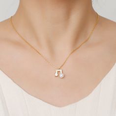 A delicate handfinished silver music note necklace - a beautiful gift for a music lover. Crafted in gold tone sterling silver, sets with a pearl and shimmering round stones on the pandant, this necklace will be certain to show a stunning look around your neck. Treat yourself or surprise her with this masterpiece. You will be sure to hit the right note with this gorgeous necklace. Where words fail, music speaks...Carat Weight: 0.275 ctStone Size: 4 mmStone Type: Jeulia® StoneNumber of Stones: 1 S Music Note Design, Where Words Fail Music Speaks, Music Note Necklace, Word Necklace, 11 Stone, Notes Design, Music Note, White Necklace, Necklace Online