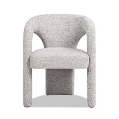 a gray chair sitting on top of a white floor