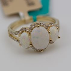 Effy 14k Yellow Gold 3 Stone Oval Opal With Round Diamonds 4.5 Grams Ring Size 7.25 Center Opal 8.5x6.2mm Round White Diamonds This Is A Beautiful New Effy Ring That Showcases These Cute Opals. The Ring Is Stamped And Is Absolutely Brand New With Tags Still Attached. The Retail On This Is $2,624 But You Can Get It For Half Of Retail! If Any Of The Tags Are Removed The Item Is Non Refundable! If You Have Any Questions Or Concerns Please Do Not Hesitate To Ask. Effy Ring, Effy Rings, Opal And Diamond Ring, Effy Jewelry, White Diamonds, Womens Jewelry Rings, Diamond White, Round Diamonds, Diamond Ring