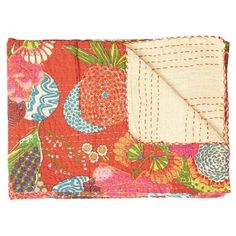 an orange and pink floral print pocketed pouch with a white square in the center