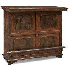 an old fashioned wooden cabinet with glass doors