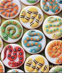 many decorated cookies with different designs on them