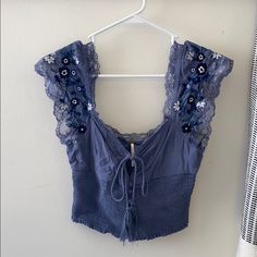 Never Worn, But No Tags. Free People, Blue Peasant Crop Top With Lace And Embroidery Detail With Navy Blue And White Flowers, Keyhole Detail With Bow In Front. Cottagecore Crop Top, Cute Top Designs, Cute Winter Tops, Funky Tops, Thrifted Tops, Witchy Fall, Peasant Crop Top, Nfr Outfits, Unique Tops