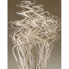 an artistic sculpture made out of white wire