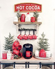 a coffee bar with red mugs and christmas decorations