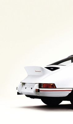 the back end of a white sports car