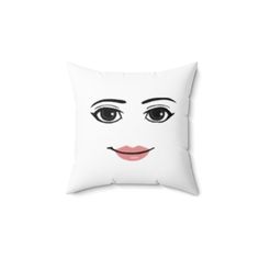 a white pillow with a face drawn on it