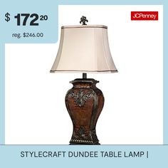 a table lamp with a price tag for $ 72 20 reg $ 240 00 and an old fashion style lamp