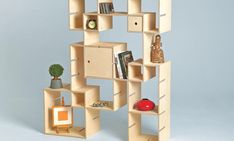 a wooden shelf with books and other items on it