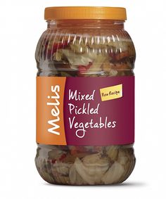 a jar of mixed pickled vegetables on a white background