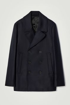 The classic pea coat is a foundation of the menswear wardrobe. Crafted from a recycled-wool blend, this double-breasted piece features a pointed collar that can be styled folded up and a quilted lining that offers additional warmth. The relaxed shape allows tailoring to fit neatly underneath. Relaxed fitButton closureFront welt pockets, internal pocketRecycled wool is made from yarn-spinning waste, yarn overstock, production-cutting waste and post-consumer garments – creating new pieces without waste  Shell: 78% Recycled wool, 21% Recycled polyamide (Recycled nylon), 1% Other fibres. Lining: 100% Polyester. Excluding trims / Dry clean Back length of size M is 78.95cm / Model wears a size M Yarn Spinning, Peacoat Men, Mens Wool Coats, Herringbone Coat, Wool Pea Coat, Wool Peacoat, Green Coat, Pea Coat, Blue Wool