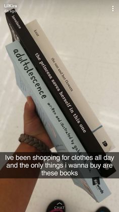 someone is holding two books in their hand and the caption reads, i've been shopping for clothes all day and the only things wannan buy are these books