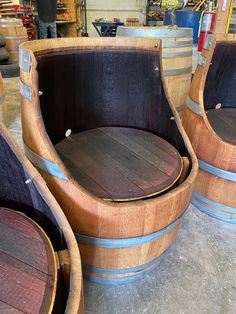 three wooden barrel chairs sitting next to each other