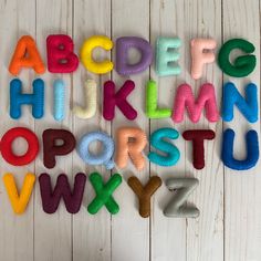 the letters are made out of felt and have different colors