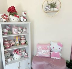 a hello kitty themed room with pink furniture