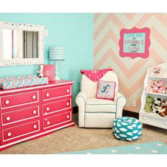 a child's room with pink and blue accents