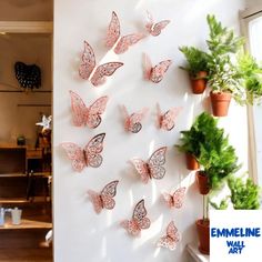 there are many pink butterflies on the wall