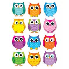 a group of colorful owls sitting next to each other on top of a white background