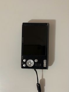 a small digital camera hooked up to a wall