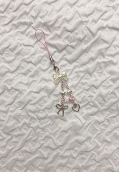 a white sheet with some charms attached to it