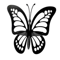 a black butterfly with white spots on it's wings