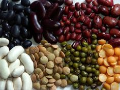 several different types of beans and nuts on display