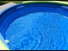 an above ground swimming pool with blue water