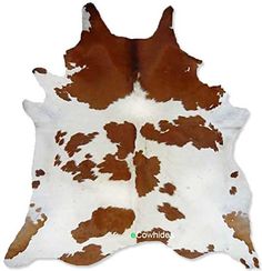 a brown and white cowhide rug with spots on the bottom, in front of a white background