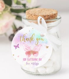 a jar filled with lots of white marshmallows