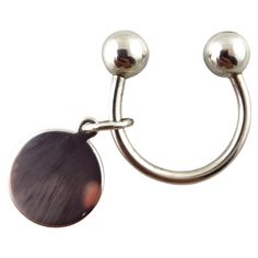 a pair of metal hooks with two balls attached to them