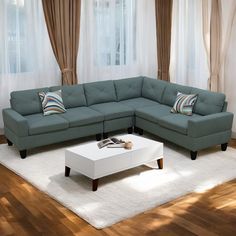 a living room with a sectional couch and white coffee table in front of the window