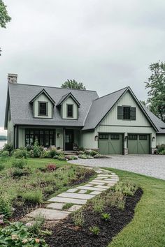 a large house with lots of windows and landscaping