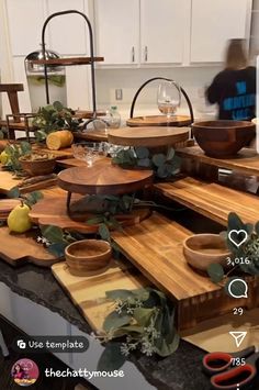 the kitchen counter is covered with cutting boards and bowls