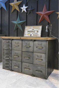 an old metal filing cabinet with five stars on the wall