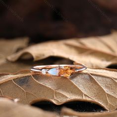 a ring sitting on top of a leaf