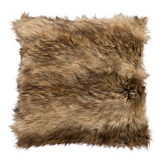 an animal fur pillow on a white background